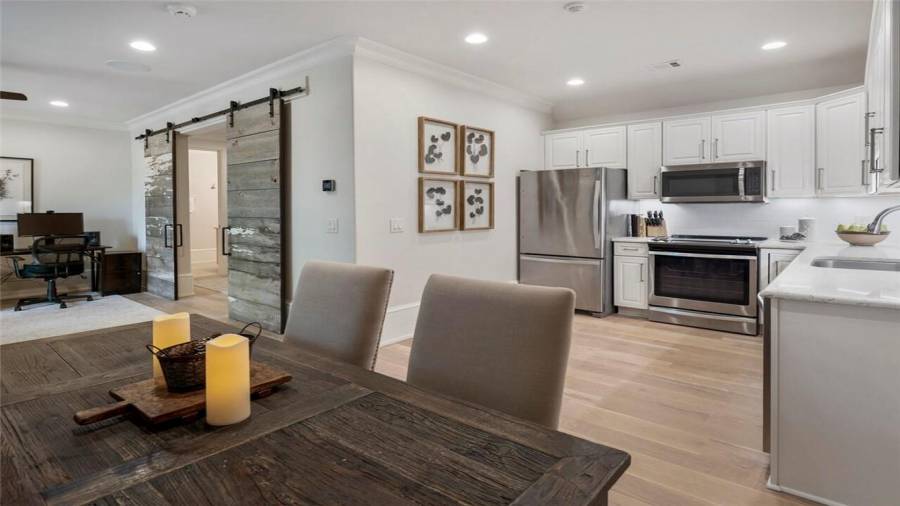 Carriage apartment with living room, full kitchen and bath, and walk-in closet with laundry.