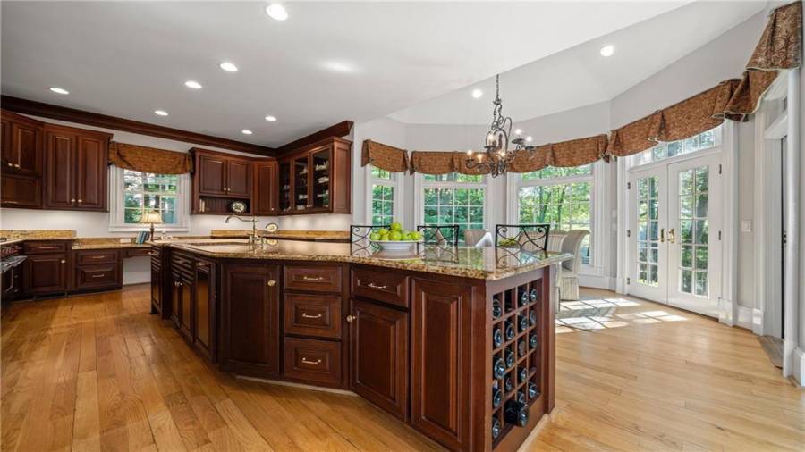 We are back in the house and focusing on this very generous sized kitchen with everything you need including top of the line appliances and a wall of windows!