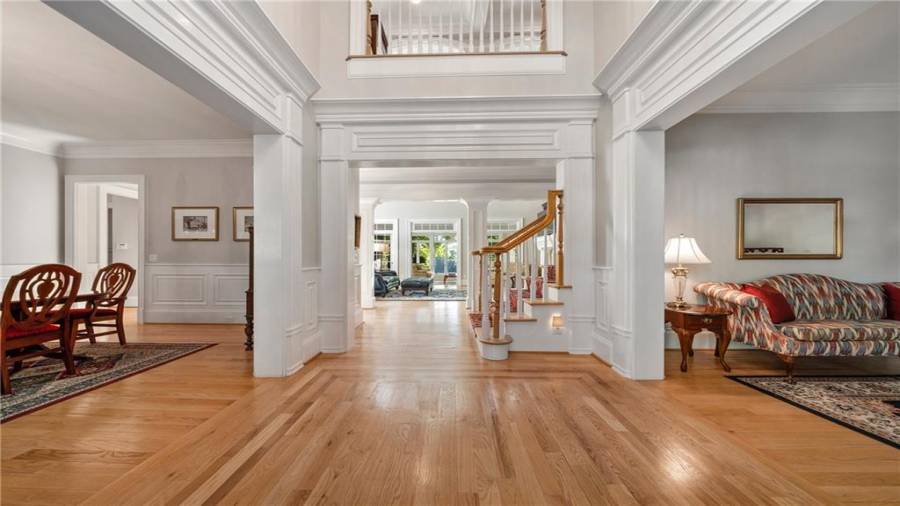 Enter through your front door to an inviting and open floor plan.  Notice the handsome hardwood floors and the moldings.  As you step further in you will be mesmerized by the view!