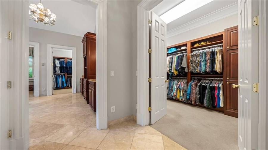 Incredible his/her walk in closets.