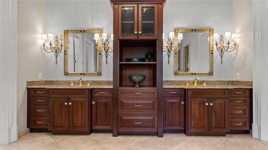 Stunning double vanities.....look at the details in the lighting fixtures and mirrors.
