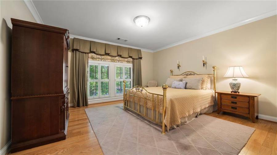 Very generous size bedroom with full bath.  Notice the plantation shutters.