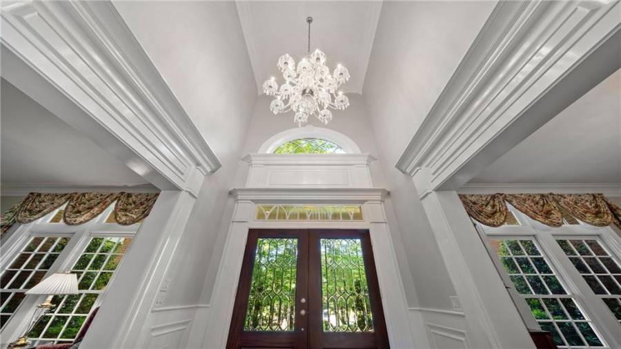 Wow! Dramatic ceiling height and look at this chandelier - which remains with the home.