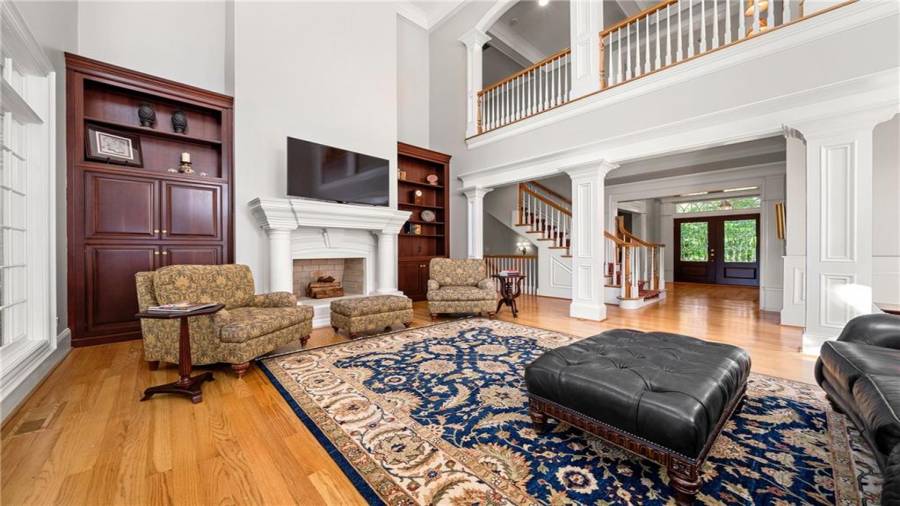 Another viewpoint, showing the open flow of the main floor.  Wonderful gas fireplace just waiting for the cooler weather!