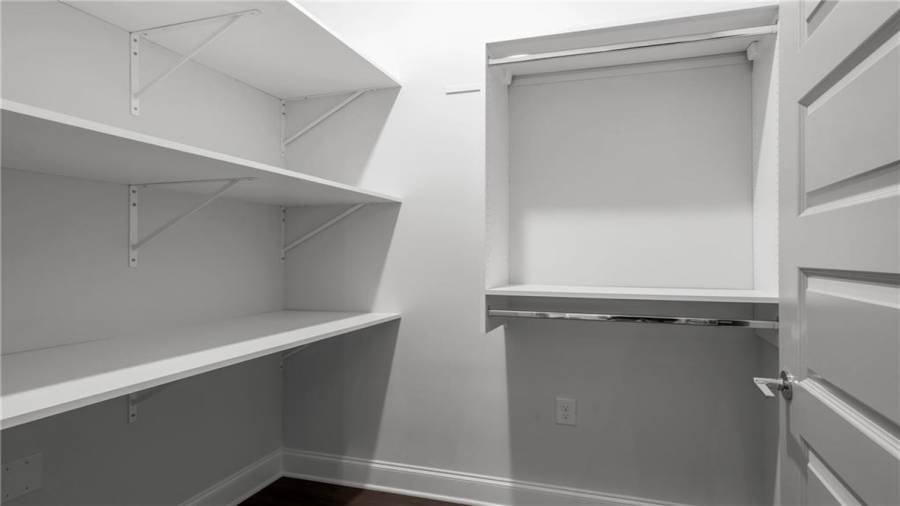 The Cottages feature an Over-sized Walk in Storage shown here.  This Space can be used a a small Home office or we can Install Optional Custom Shelving shown here.
