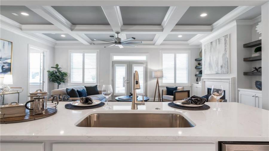 Details Galore! Large Kitchen Island with Built in Trash Pullout, Designer Stainless Faucets and Quartz Counter tops!