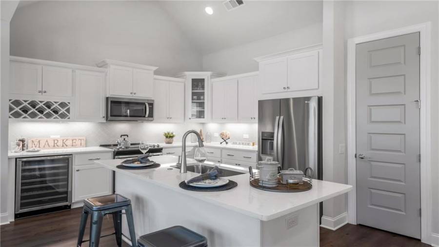 Our Odd Numbered Cottages offer a Custom Wine Cooler and Wine Rack. Designer White Shaker Cabinetry is so today!