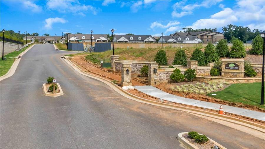 The Front Entrance is a work in Progress.  The Gates and Sidewalks will be in very soon!