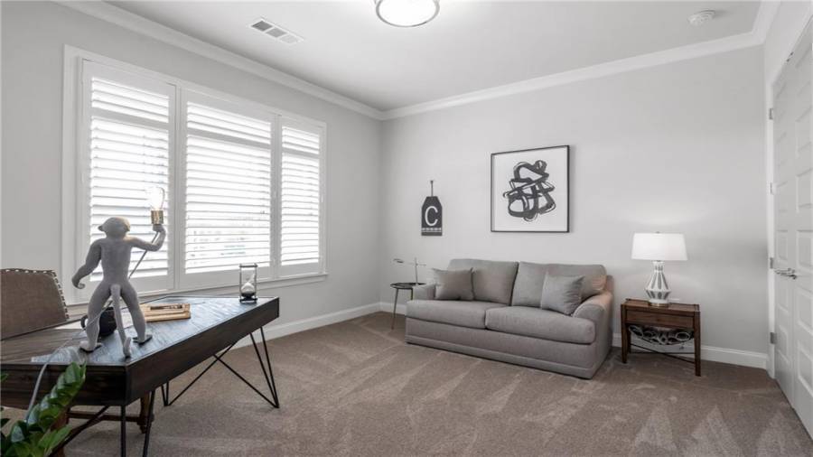 This Front Bedroom has Endless Possibilities.  Use this as a Home Office, Guest Suite or a Den for watching Late night TV.....