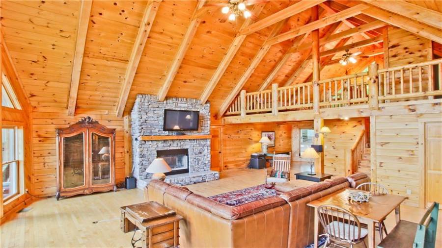 Note the beamed cathedral ceiling and the hardwood floors.