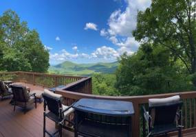 The panoramic views from this spectacular log home are stunning.