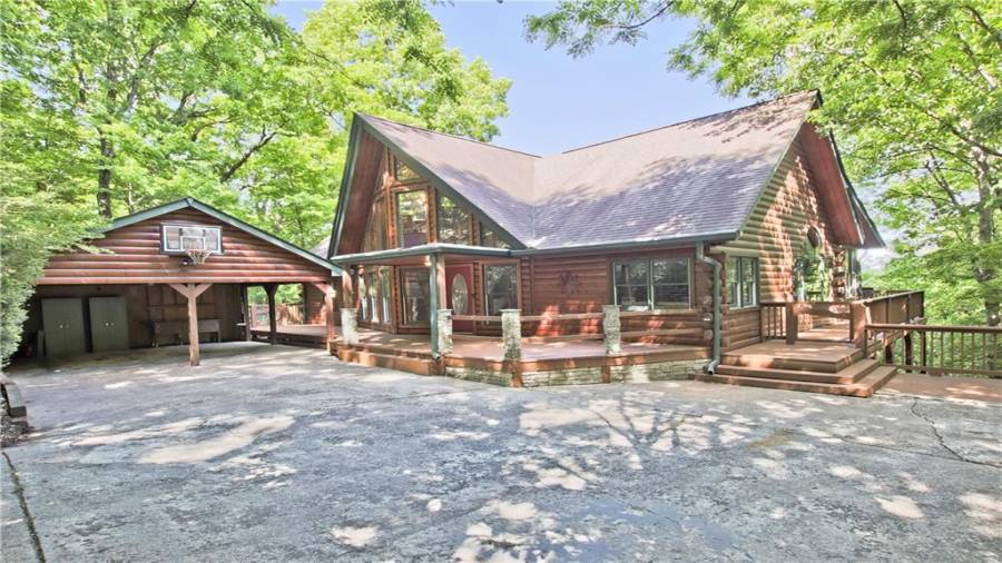 1397 Chestnut Cove Trail sits at the end of a cul-de-sac on 3.16 acres in Bent Tree. The oversized carport can hold two cars and has room for storage. This home is being sold furnished.