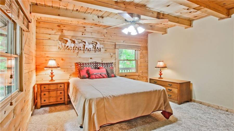 This guest room is on the main floor, adjacent to a full bath, and in a quiet, private area away from the main rooms of the home.