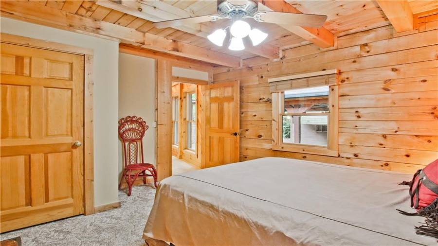 This guest room is on the main floor, adjacent to a full bath, and in a quiet, private area away from the main rooms of the home.