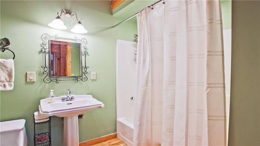 Full bath on main floor that serves the guest bedroom and other guests as well.