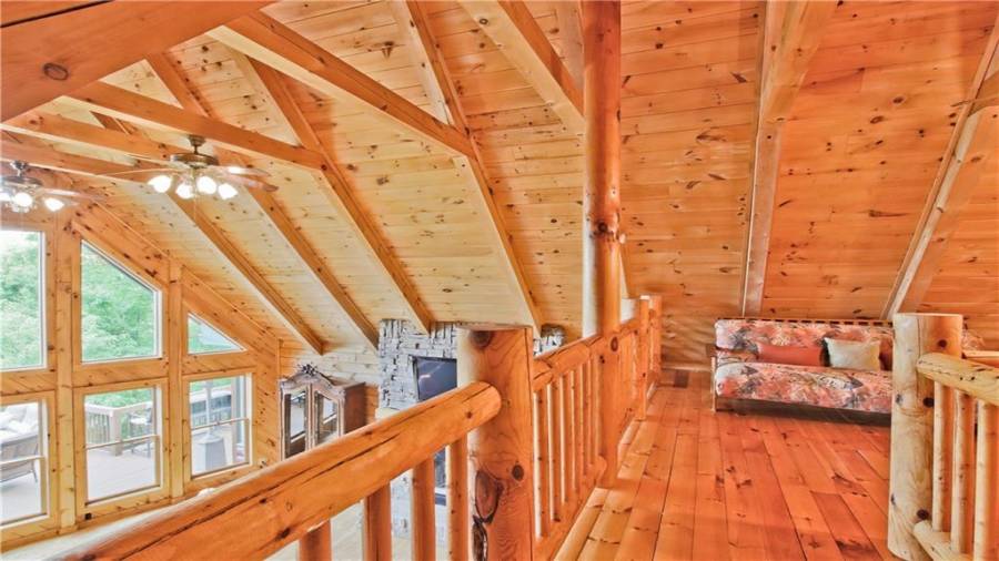 The loft area features a reading nook or home office. The loft area also has a half bath and another flex space that could either be a home office or over flow for guests.