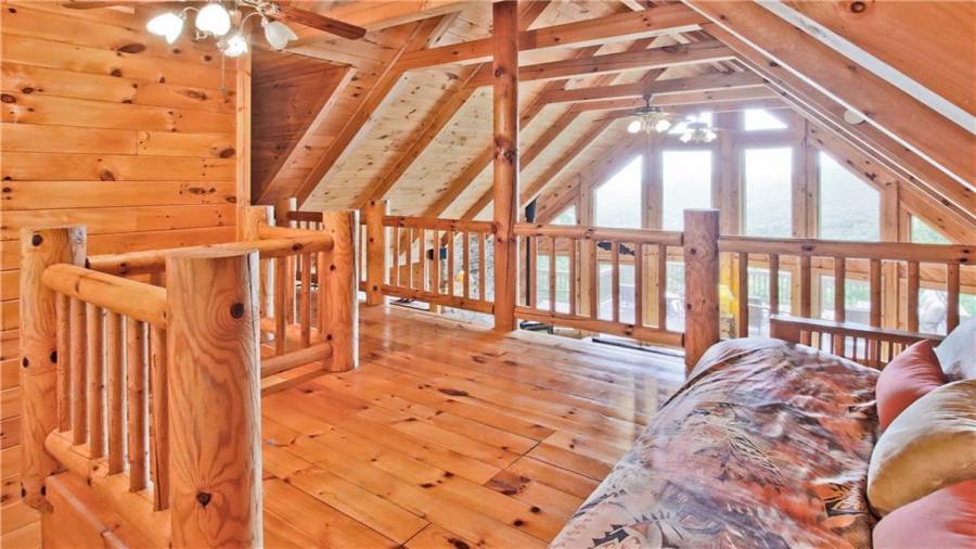 The loft area features a reading nook or home office. The loft area also has a half bath and another flex space that could either be a home office or over flow for guests.