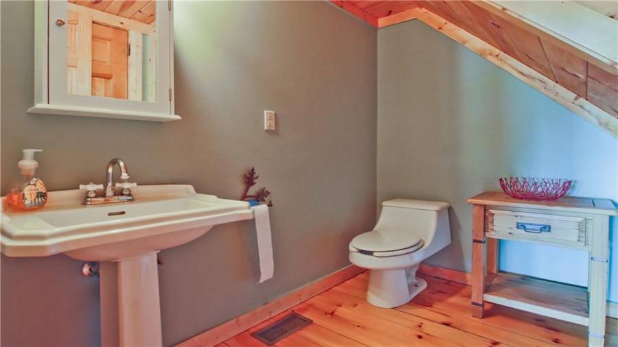 The loft area features a reading nook or home office.  Great views from this room as well. The loft area also has a half bath and a guest bedroom.