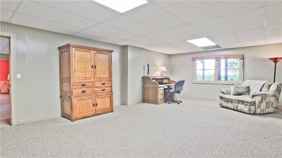 Another room to use as you please. It was used as a home office which had plenty of room for filing cabinets, office equipment, and drafting tables. It would be a great craft room too.