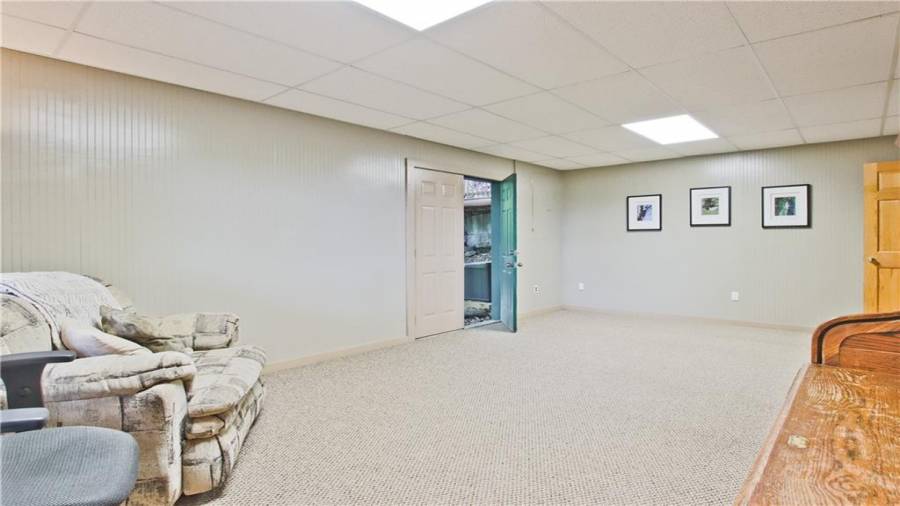 This multi-purpose room has an exterior door which leads out to the left side of the home.