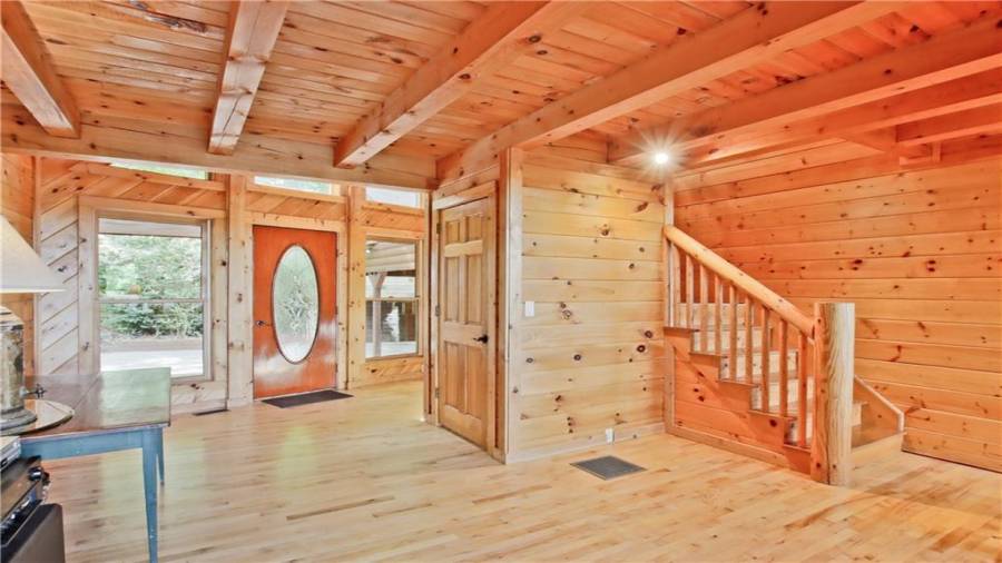 The front door is flanked on both sides by windows which lets the natural light flow in.