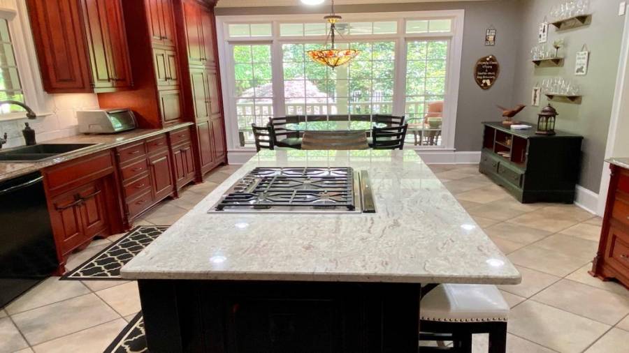 The Center Island offers a 5 Eye Gas Surface Unit and a Breakfast Bar