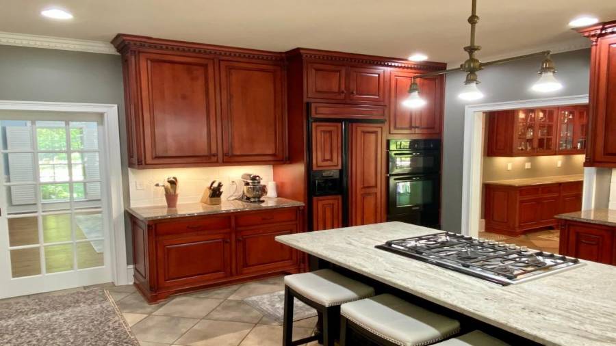 Built in Refrigerator and even more cabinetry.... note the Pockert French Door separating the Dining Room and Kitchen?