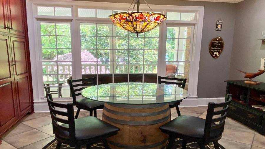 The Breakfast Area overlooks the Covered Back Porch and the English Gardens