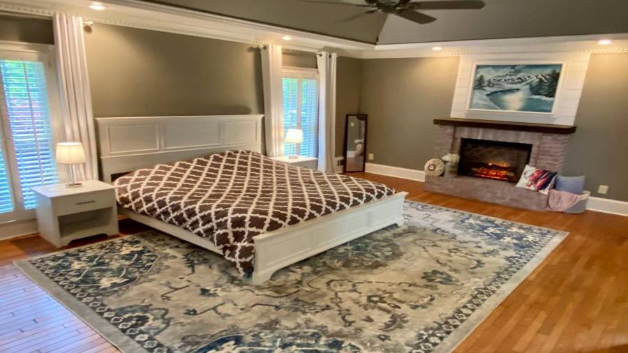 The Main Level Primary Bedroom is spacious and offers a 2nd Fireplace with ambient heating