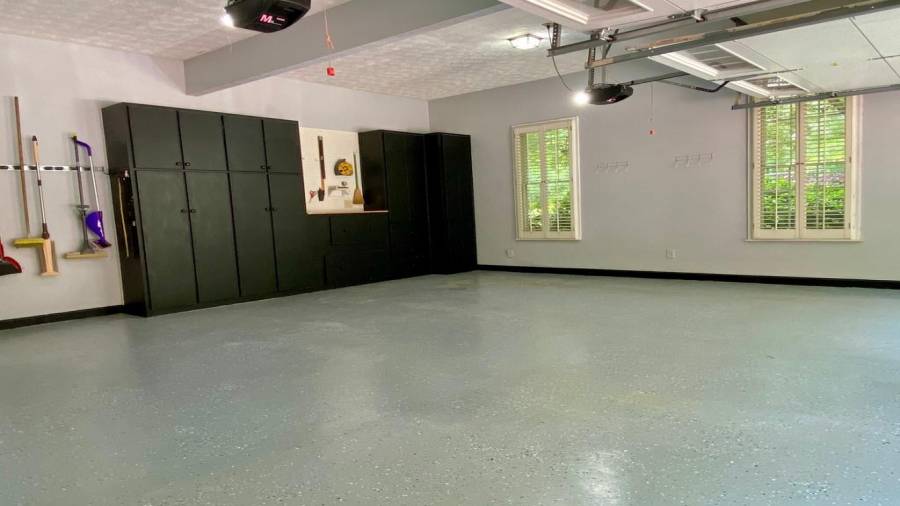 The Upper Level 2 car Garage completes the Main Level and has built in storage and a coated floor