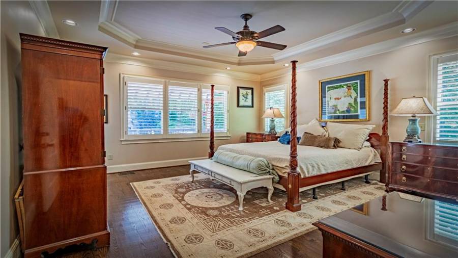 Master bedroom with hardwoods on main level.