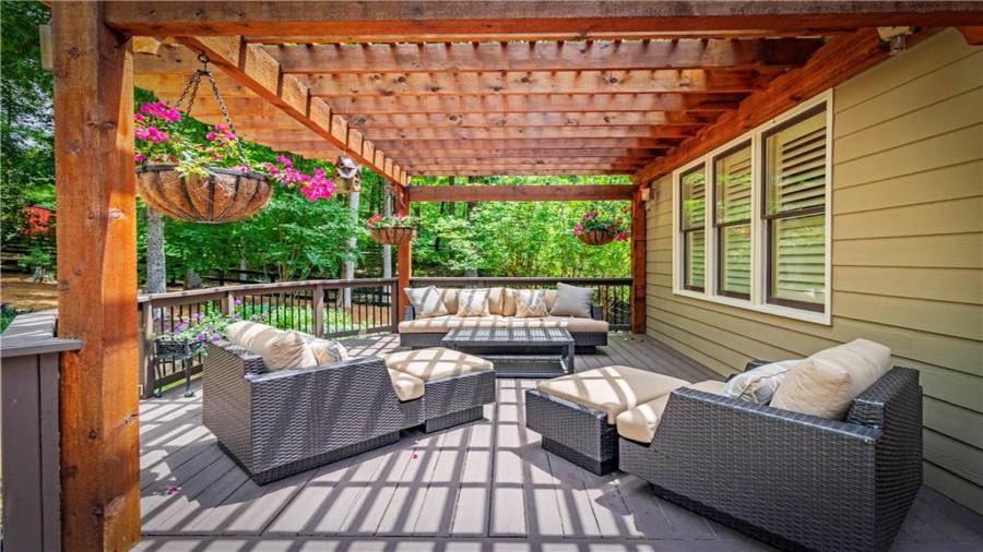 Relax on the deck under the cedar Portico.