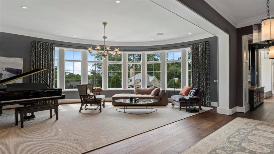 Living room is surrounded by beatiful views of the property.