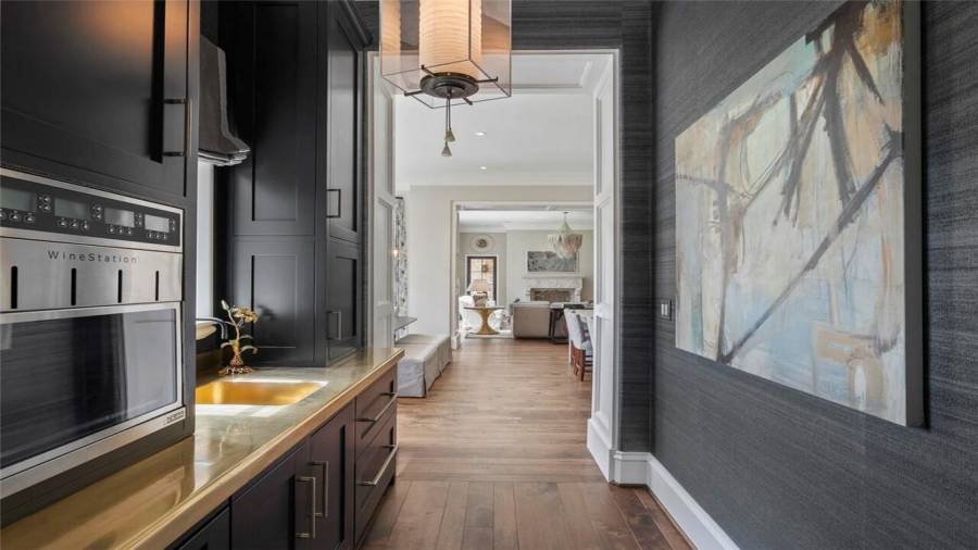 Butlers pantry leads into the massive kitchen.