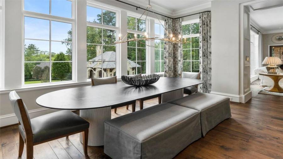 Breakfast room in the kitchen is flooded with sunlight.