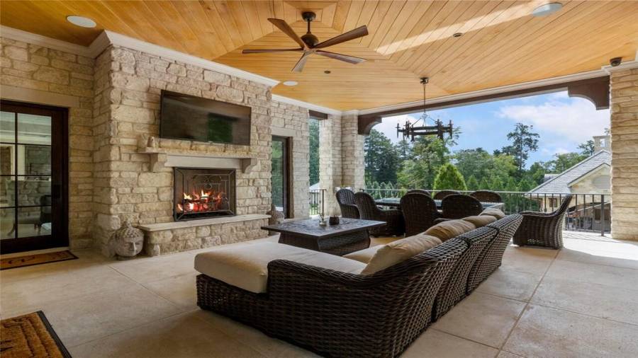 Outdoor fireplace and dining room off of the family room.