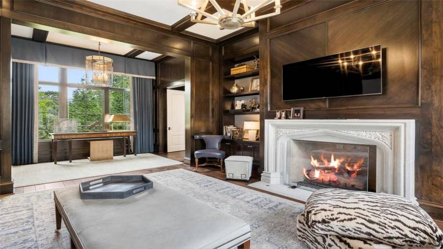 Beautiful stone fireplace in the owner suite study.