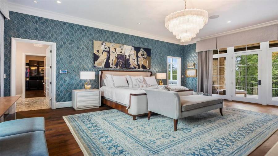 Owners suite with covered patio overlooking the property.