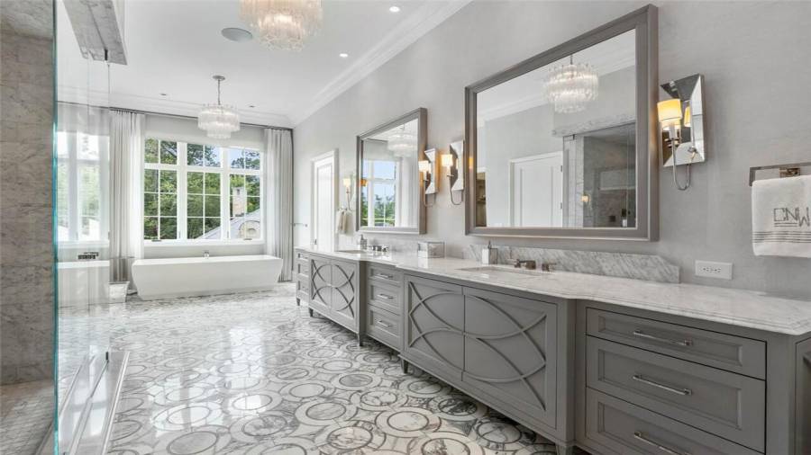 Heated floors, motorized blinds, dual dressing rooms and water closets.