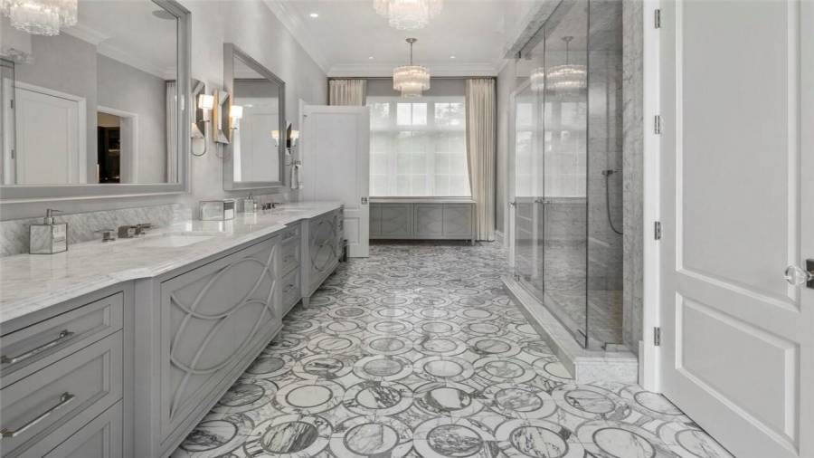 Owner suite bathroom is spacious and filled with sunlight.