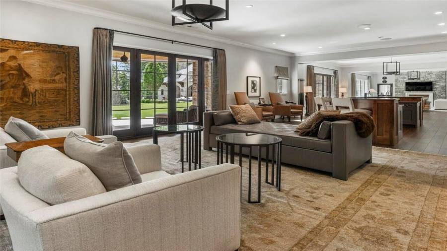 Terrace level features open entertaining spaces centered by a bar with seating.