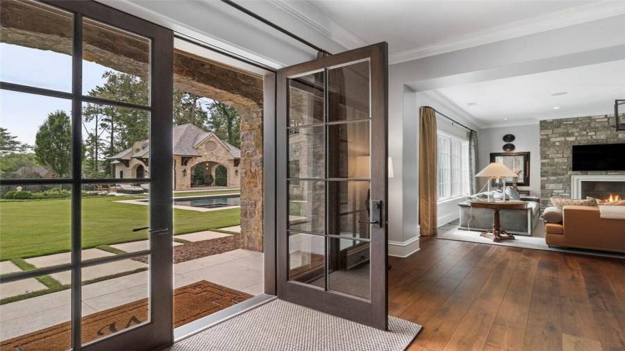 French doors open to the pool and patio.