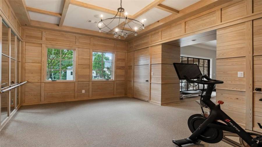 Wellness center, gym, yoga room, spa bath with sauna, doors out to patio.