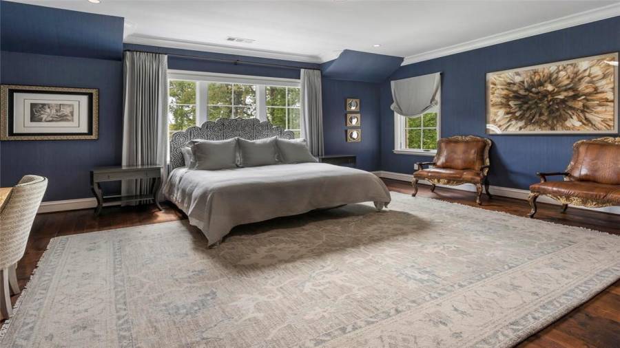 Guest suite with surrounding windows.