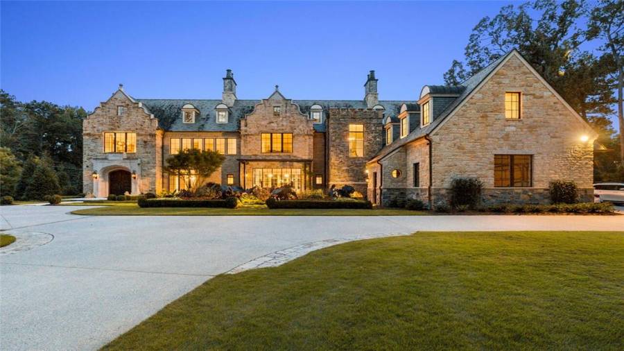 Stunning facade complete with gardens.