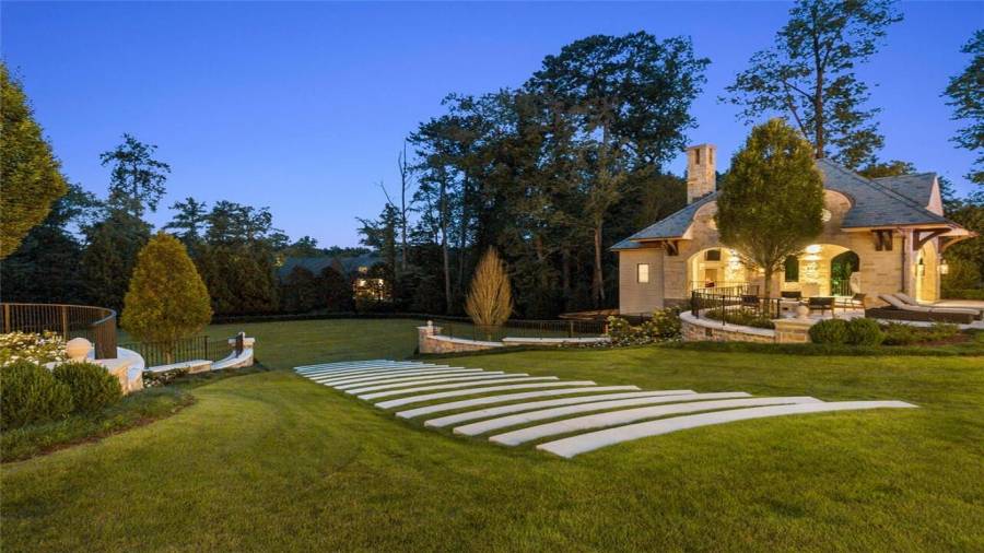 Stone steps surround the pool and patio.