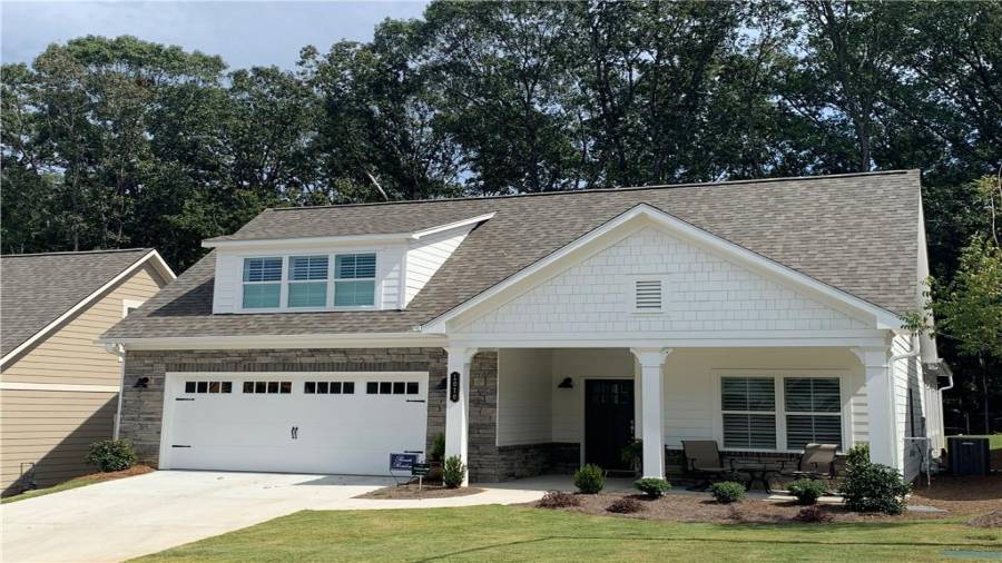 Representation Photo of Promenade III Elevation.  Subject property to have brick.