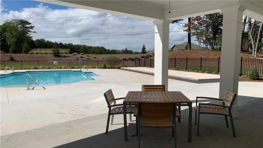 Covered patio of clubhouse stretches the length for plenty of seating with friends and neighbors.