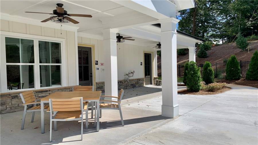 Covered patio of clubhouse stretches the length for plenty of seating with friends and neighbors.