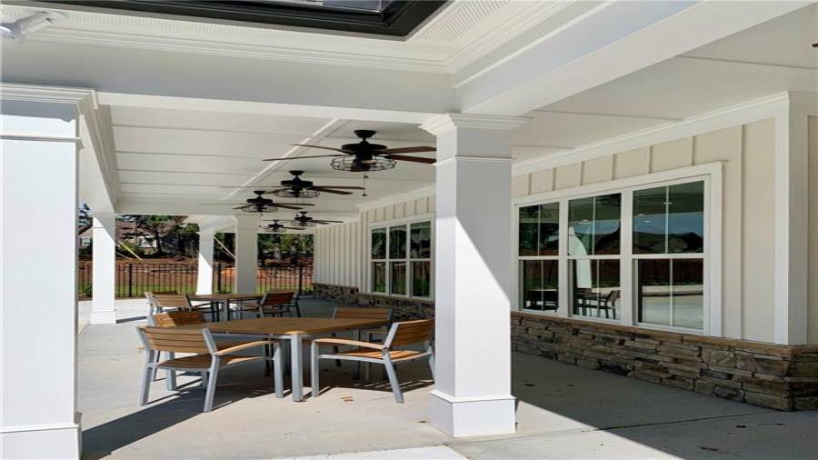 Covered patio of clubhouse stretches the length for plenty of seating with friends and neighbors.